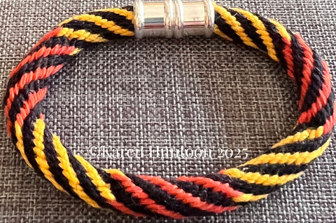 "16 strand Kongoh Gumi Bracelet with Continuous Spiral Pattern and Changing Colors" - Black/Rust/Mango